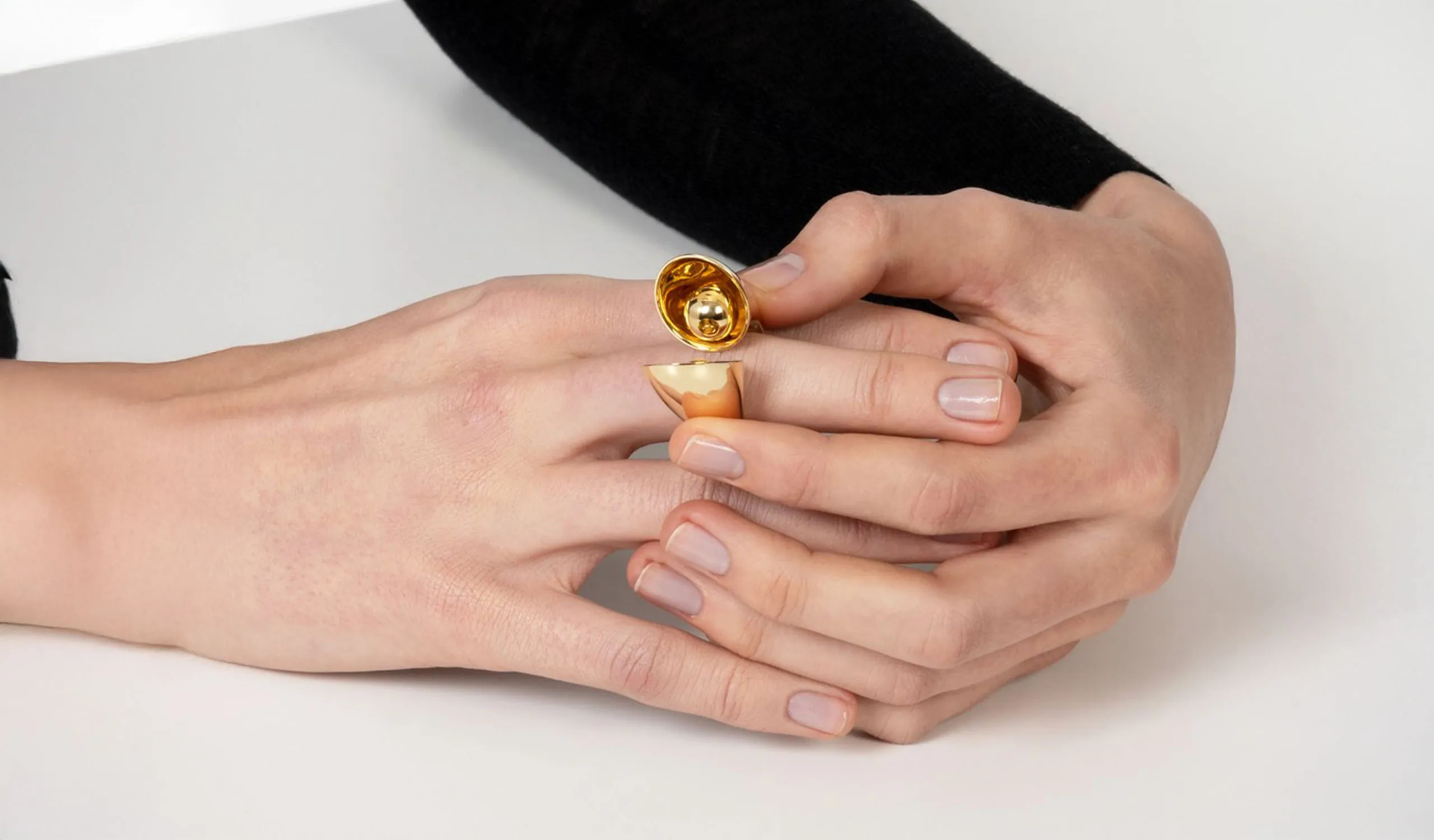 Vram Echo Eon ring with hollow kinetic spheres smartly nested into the ring’s chambers, handcrafted in 18k yellow gold