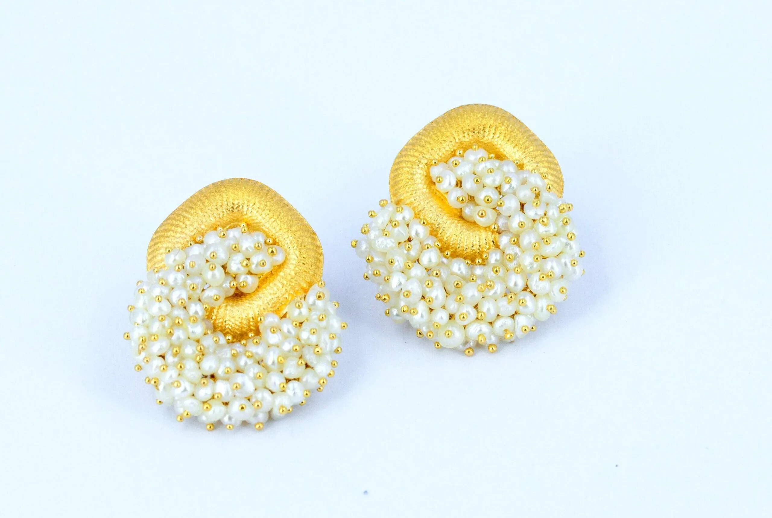 Pearl Biography earrings in 21k gold with clusters of natural Bahraini pearls 