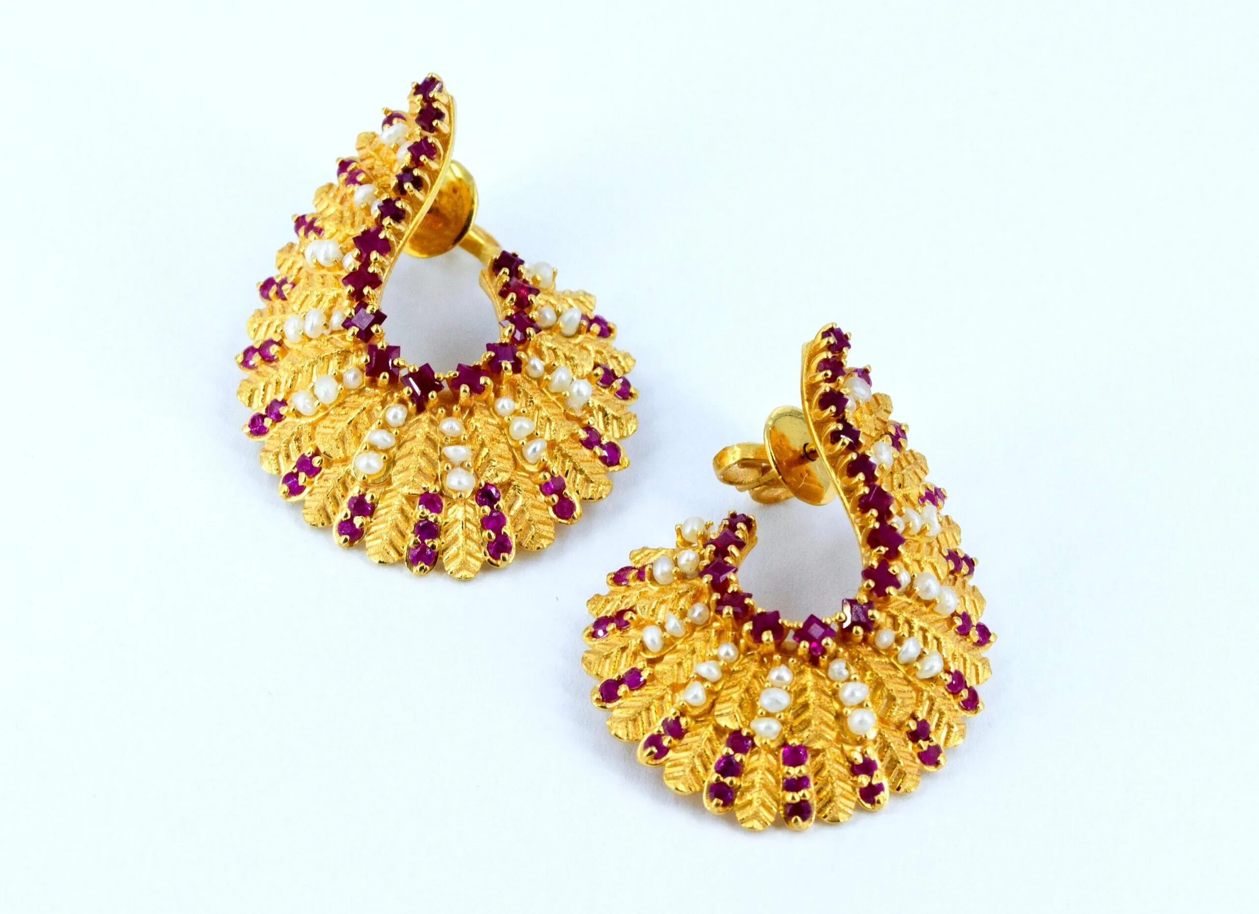 Pearl Biography Snail Ruby earrings in 21k gold with 1.15 carats of natural Bahraini pearls and 1.92 carats of rubies 