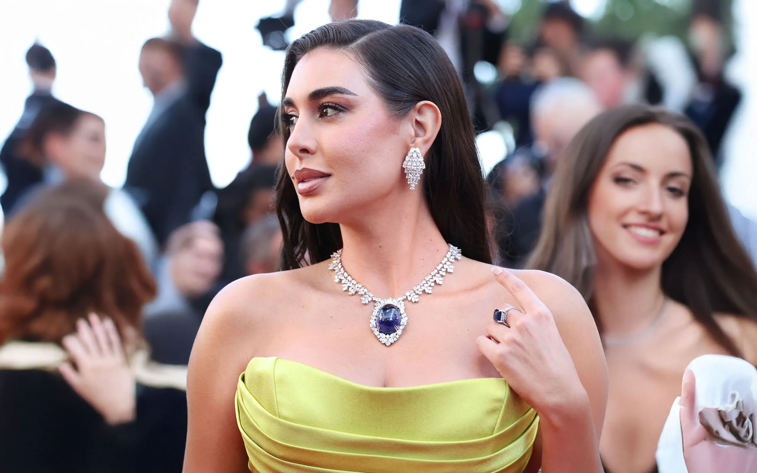 Egyptian actress and model Yasmine Sabri wears a Chopard High Jewellery necklace with a large tanzanite cabochon to the Cannes Film Festival 2025
