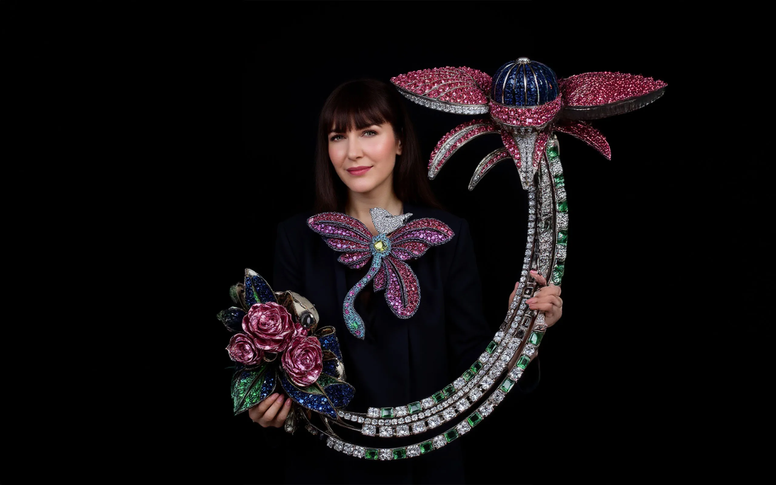 Katerina Perez is shown interacting with a super-sized sculpture of diamonds and precious gemstones, imagined by AI artist Anastasia Rogozhina