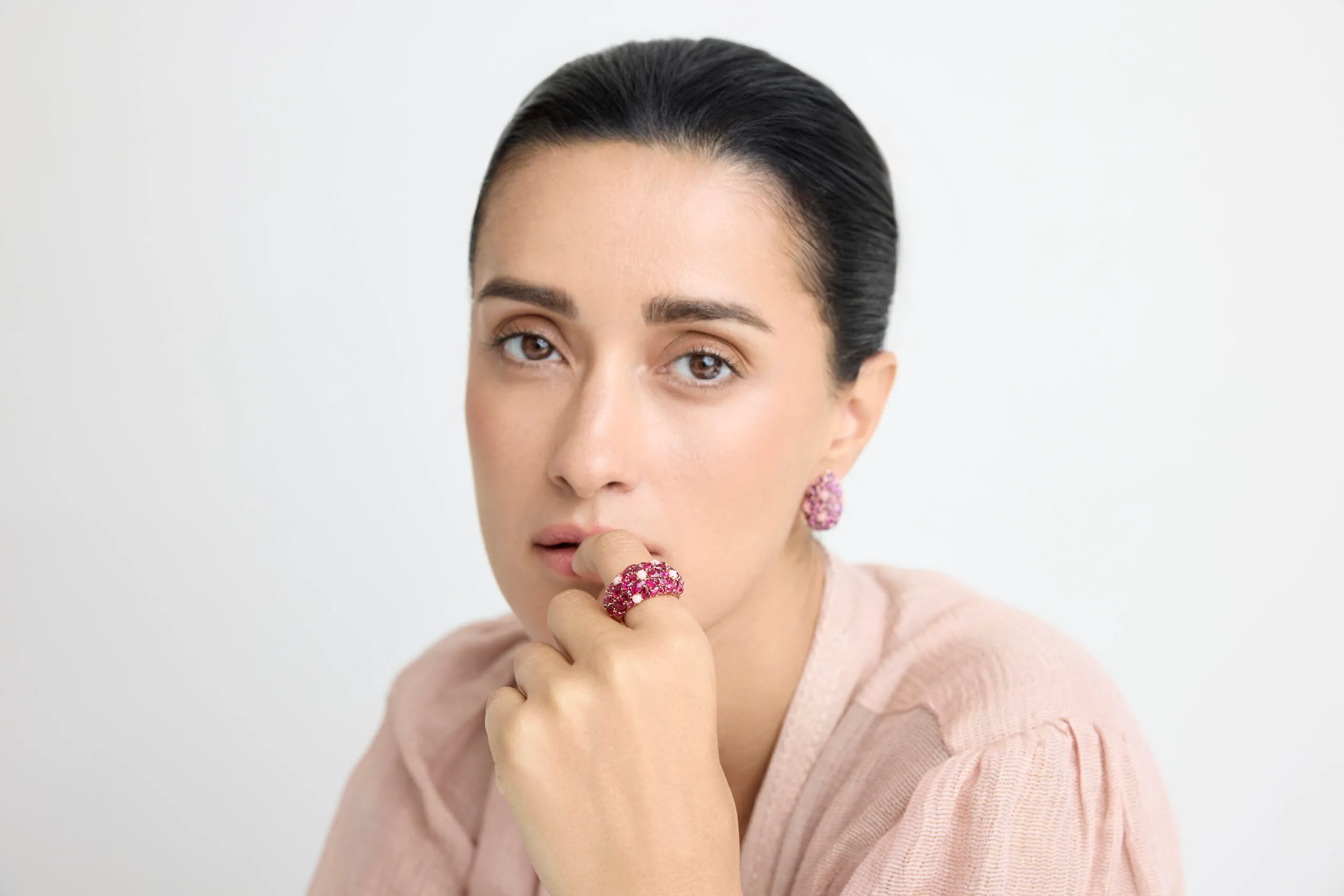 A model wears a ruby ring and matching earrings from the Jaipur collection by Gyan Jaipur