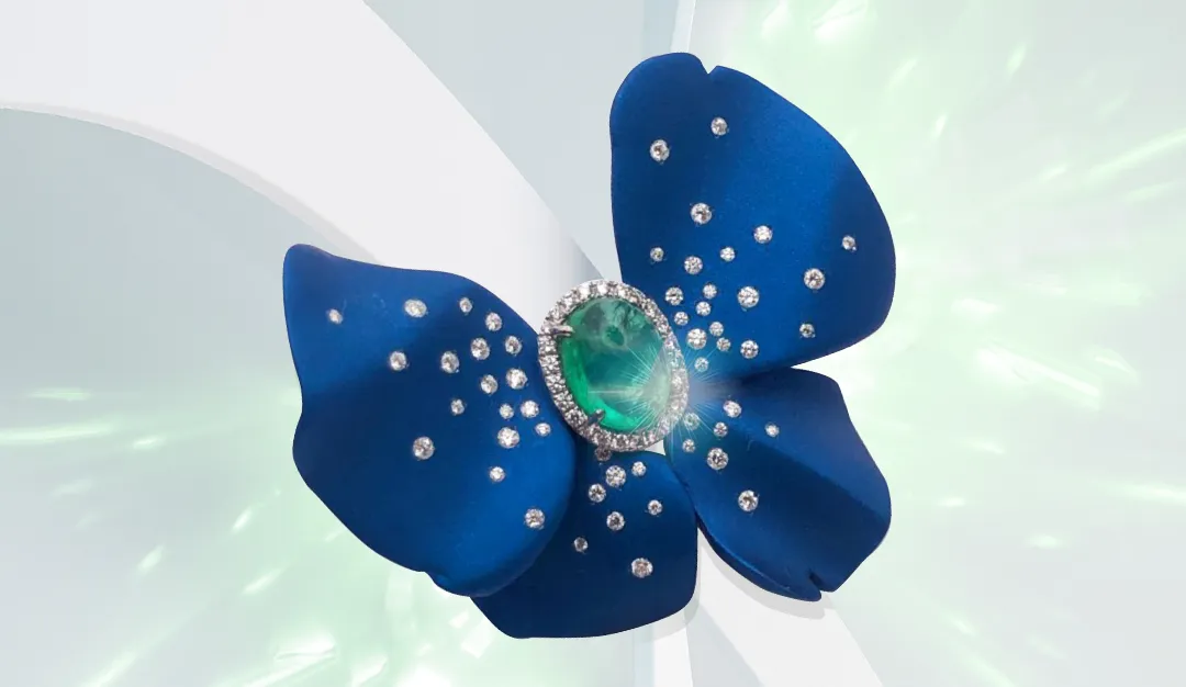 Mayiana MY Butterfly ring with a 2-carat Colombian emerald and diamonds set in 18k white gold and blue aluminium 