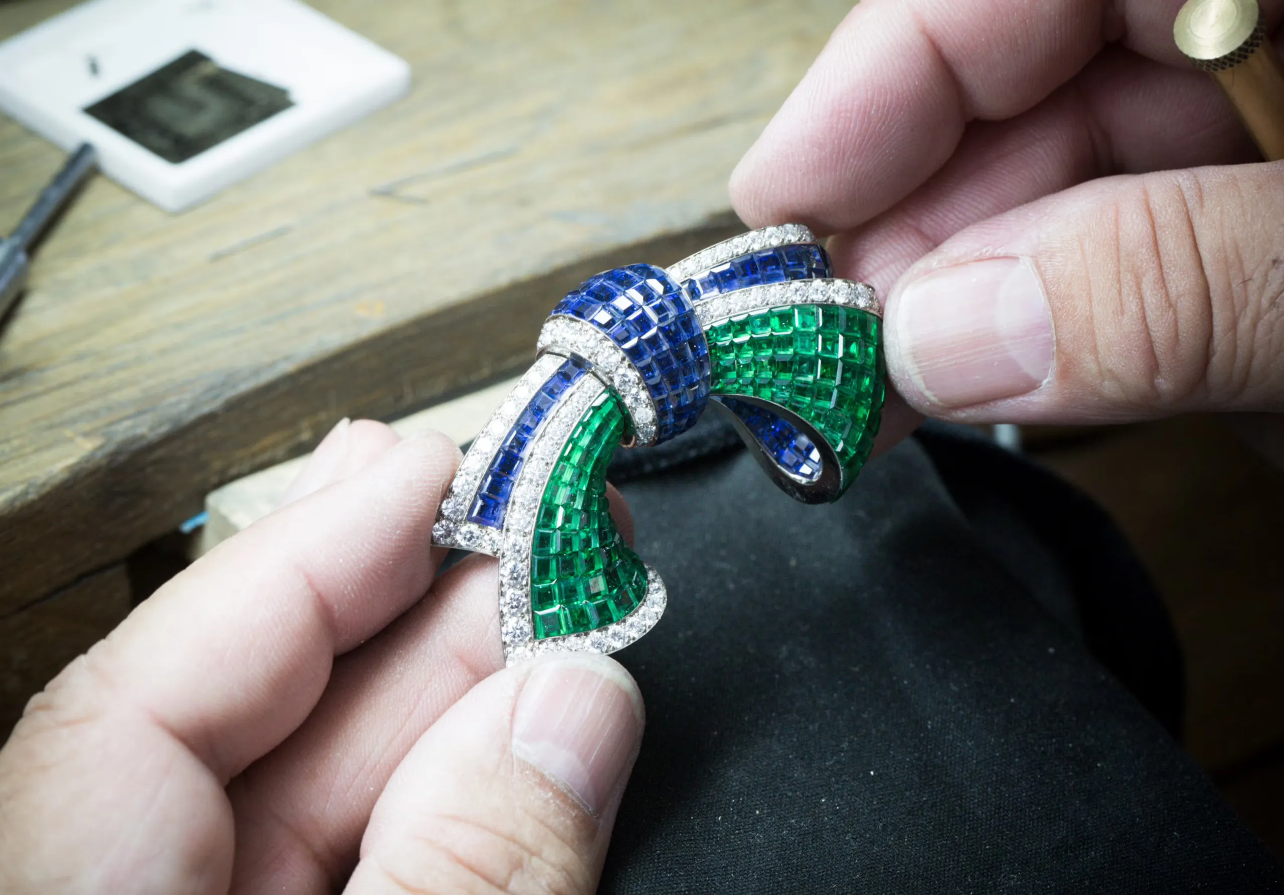 The Mystery Setting enables Van Cleef & Arpels to set stones—usually rubies, sapphires and emeralds—in such a way that no metal prongs are visible