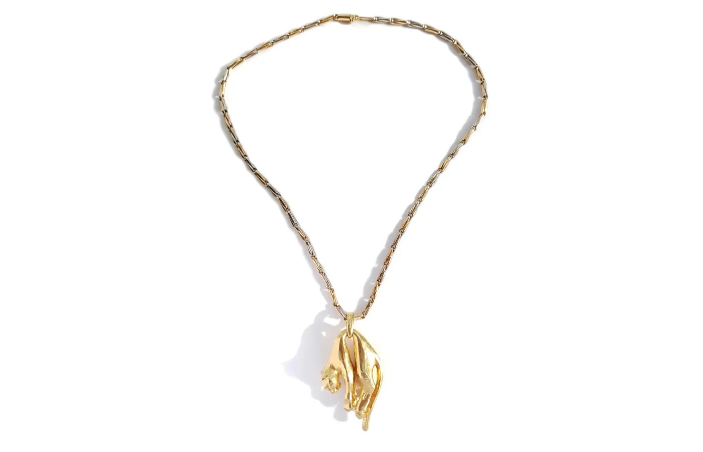 Vintage 1981 Cartier Panthère molle pendant, presented on the original 1980s bi-colour gold chain and an additional silk cord, available at Bloomsbury Manor.