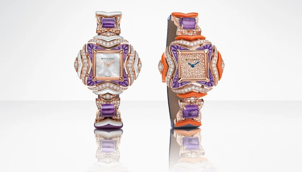 <p>Bulgari Geometry of Time watches in gold with mother of pearl, diamonds, amethysts and coral</p>
