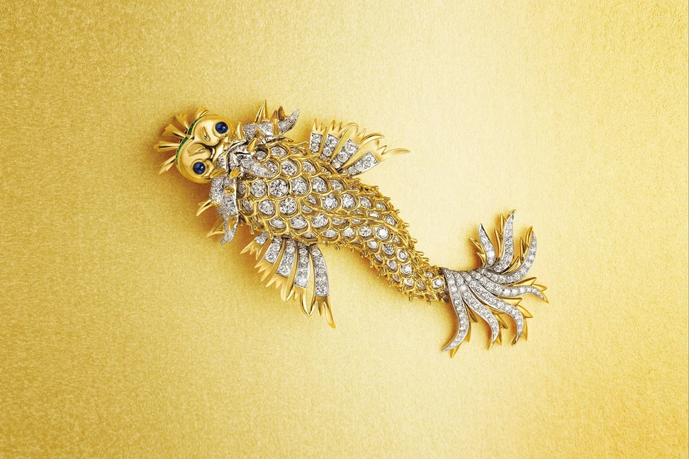 <p>A charming ‘Dolphin’ brooch with diamonds, sapphires and emeralds by Jean Schlumberger</p>
