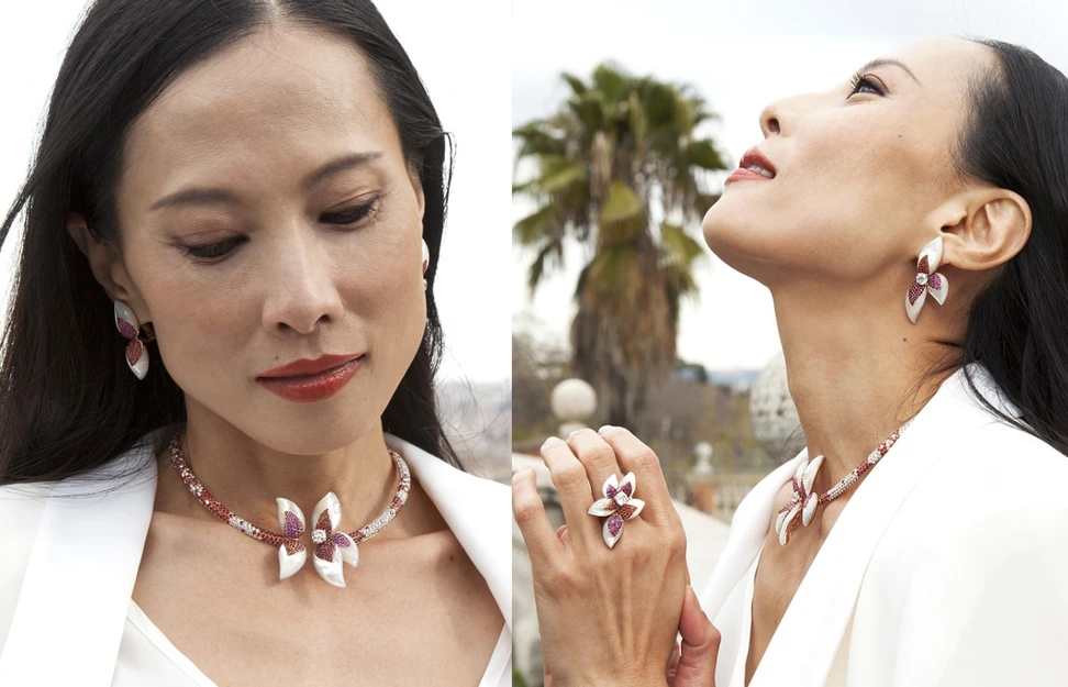 <p>A model wears an 18k rose gold necklace, earrings and a ring from the Lilium collection by J’OR Jewels, set with pink and orange sapphires, rubies, diamonds and mother of pearl</p>
