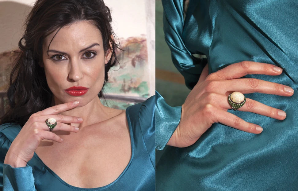 <p>A model wears the J’OR Jewels Ego ring with a precious white opal cabochon, black diamonds and tsavorites in 18k white gold</p>
