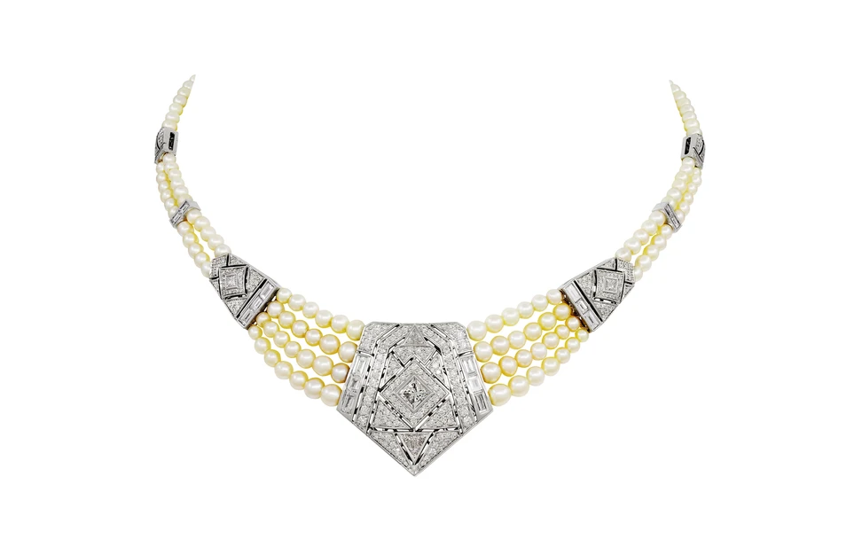 <p>Al Zain Arab Deco necklace with four strings of oval-shaped pearls and a shield of round brilliant-cut, princess-cut and baguette-cut diamonds in a pentagon shape, set with 50.80 carats of pearls and 5.75 carats of diamonds </p>
