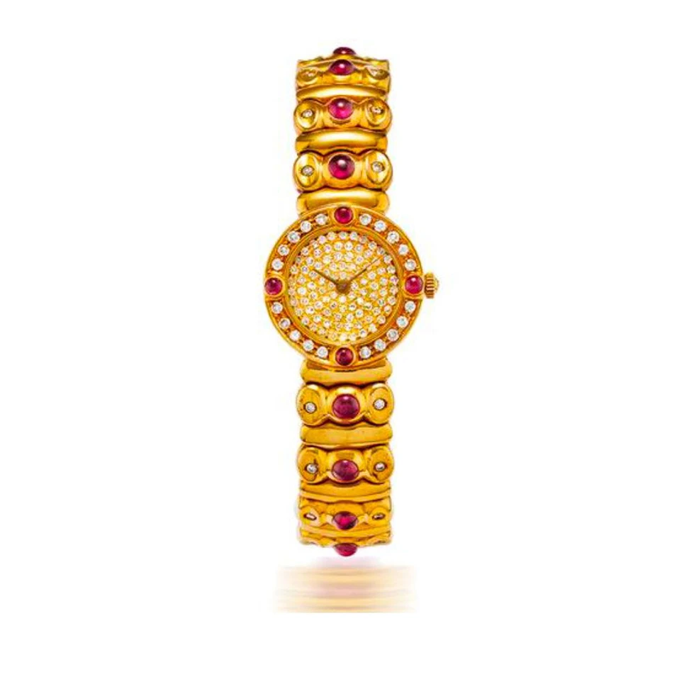 <p>An 18k gold, diamond and ruby-set quartz bangle watch, circa 1990, owned by an Italian family and due to be sold by Bonhams Paris in November 2021</p>
