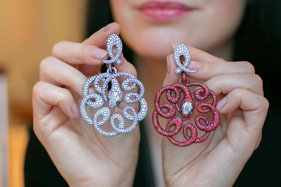 <p>Antonio Seijo &#8216;The Sprial and the Serpent&#8217; reversible earrings with diamonds and rubies in gold and titanium</p>
