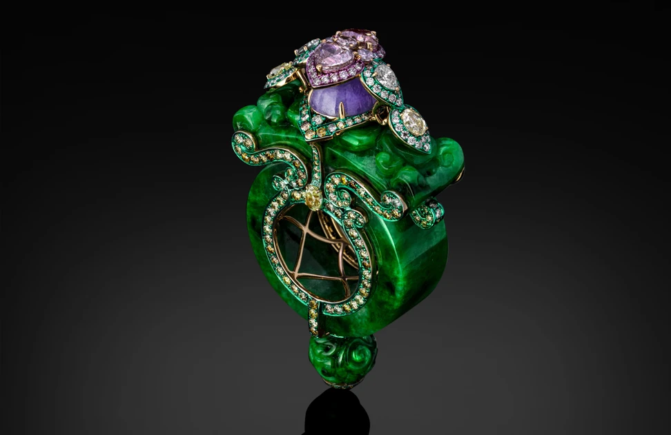 <p>Austy Lee The Ring of Fuxi from The Jade Dynasty collection with Burmese green and purple jades, black enamel and fancy pink and yellow diamonds set in 18k yellow gold </p>
