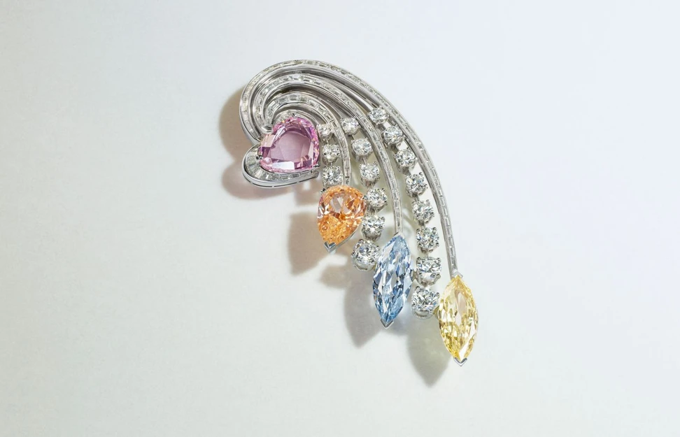 <p>Bulgari brooch with a fancy intense orange pear brilliant-cut diamond of 5.14 carats, fancy intense purple-pink modified heart portrait-cut diamond of 5.00 carats, fancy blue marquise brilliant-cut diamond of 4.26 carats, fancy intense yellow marquise brilliant-cut diamond of 3.82 carats, baguette-cut and round diamonds, platinum and 18k white gold (Lot 88) – Included in the Christie’s The World of Heidi Horten: Magnificent Jewels Part I auction</p>
