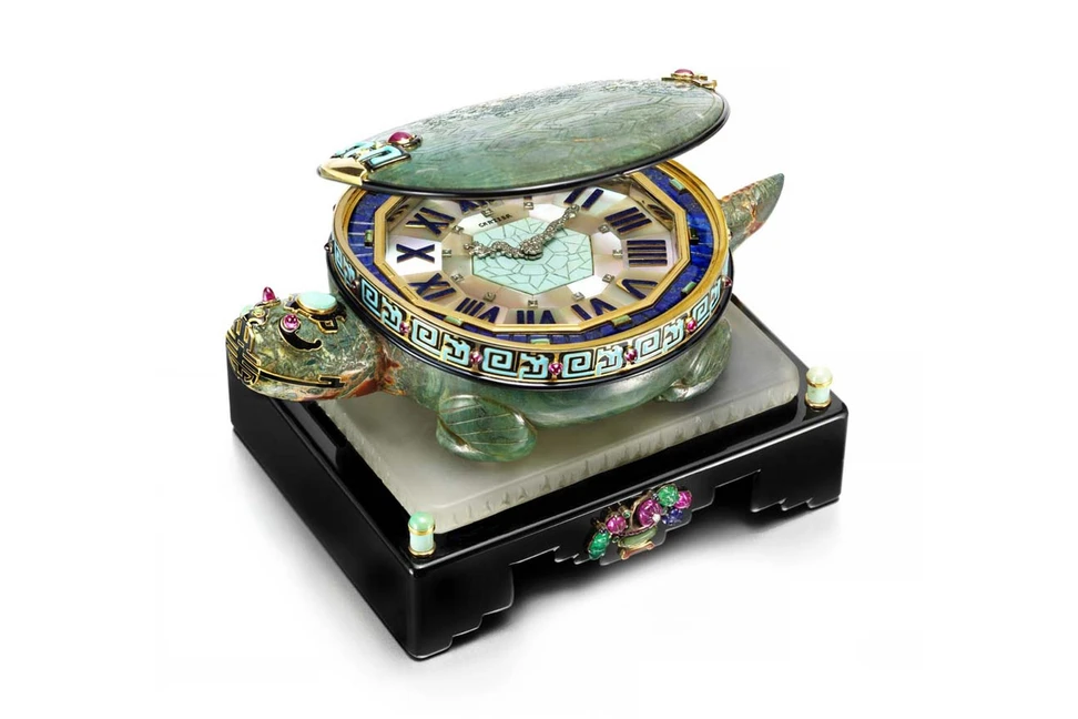 <p>Cartier’s 1928 Art Deco Turtle clock, to be exhibited by Siegelson at Masterpiece London, features a clock face edged in gold with diamond-set hands in the form of a dragon, hidden inside a turtle’s shell decorated with black and turquoise enamel and ruby cabochons</p>