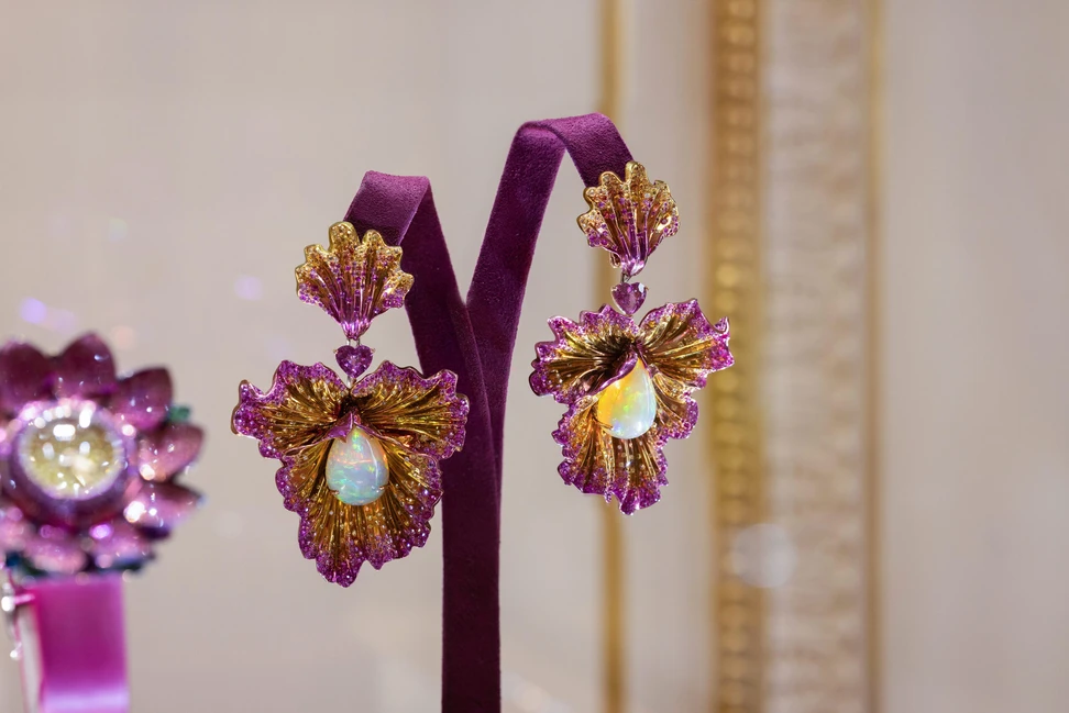 <p>Chopard Flower earrings with 18.09 carats of opal cabochons, two heart-shaped pink sapphires totalling 3.28 carats, pink sapphires of 6.84 carats, yellow sapphires of 3.41 carats and 1.74 carats of orange brilliant-cut sapphires, alongside ruby and diamonds in titanium, part of the Caroline&#8217;s Universe Red Carpet High Jewellery Collection 2025</p>
