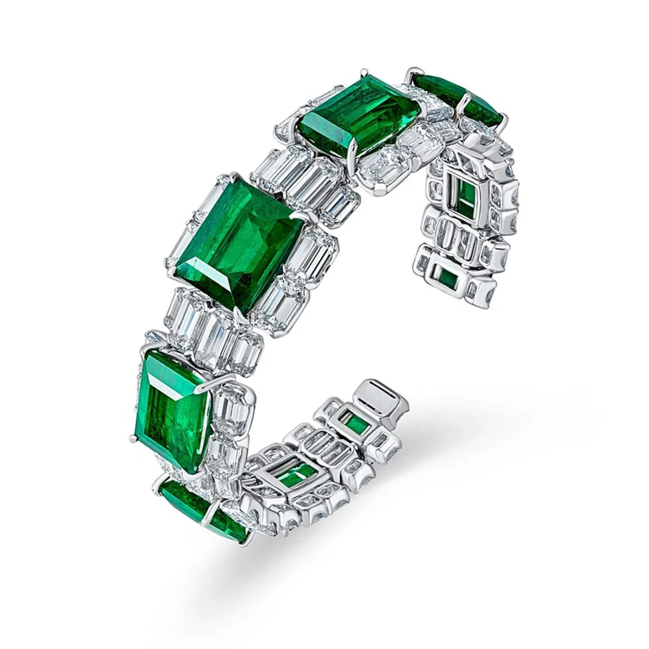 <p>David Morris ‘Important’ bangle features 42.34 carats of Colombian emerald cut emeralds and diamonds set in 18 karat white gold</p>
