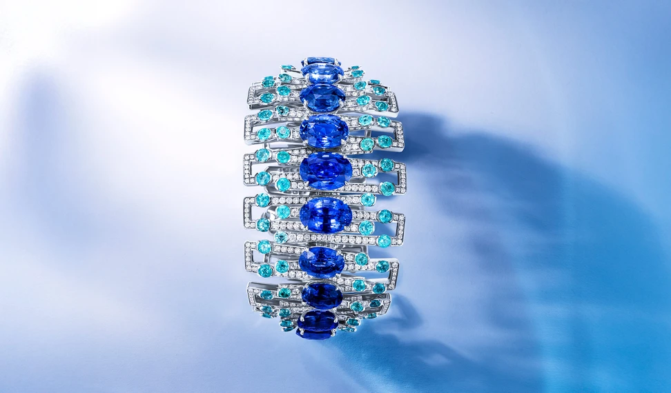 <p>Abacus High Jewellery cuff with 75.79ct of unheated oval sapphires, 16.66ct of round Brazilian Paraiba tourmalines and 10.51ct of round diamonds set in 18ct white gold</p>