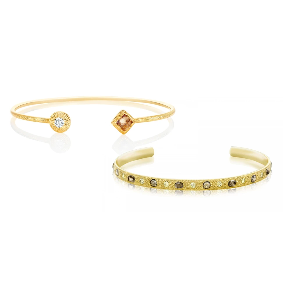 <p>De Beers Talisman collection open bangles in yellow gold with rough and faceted diamonds</p>