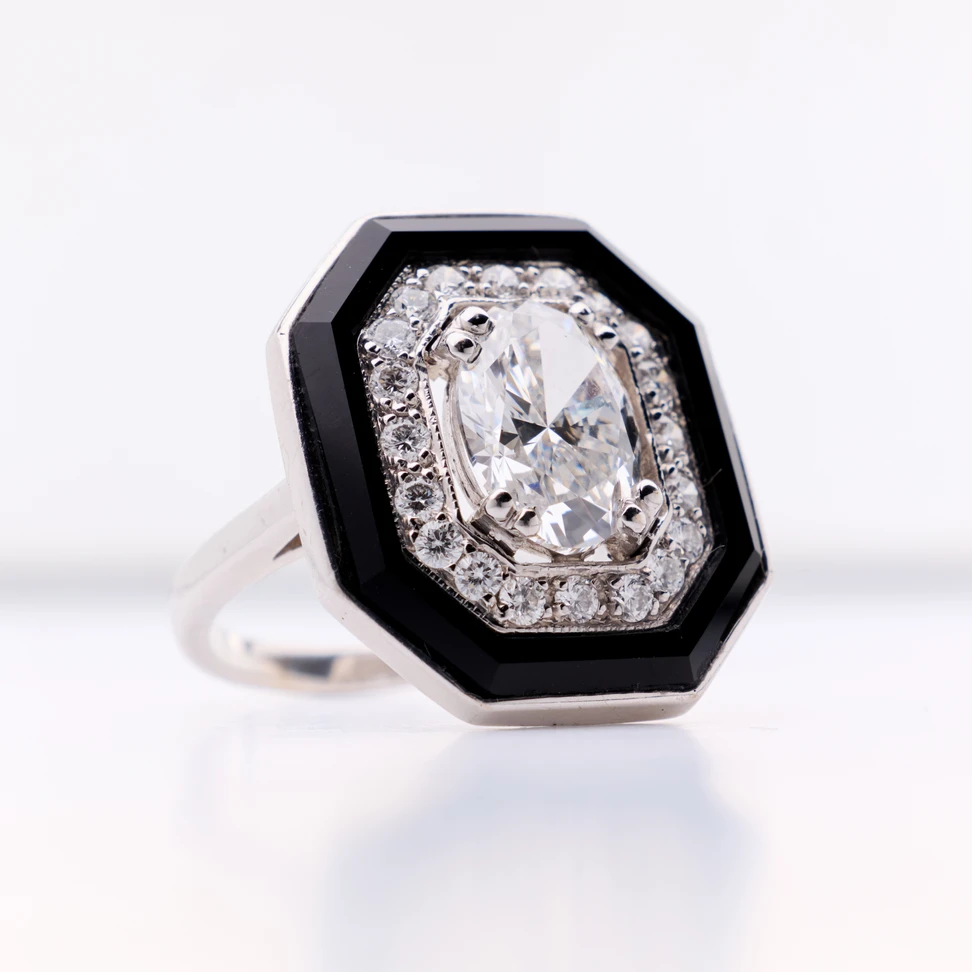 <p>Faith Jewels Deco ring with a flawless oval-shaped diamond, hand-cut onyx and further diamonds in a striking octagonal silhouette, crafted in 18k white gold</p>
