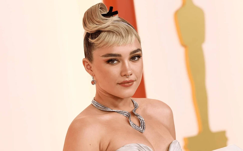 <p>Florence Pugh wears a pair of Tiffany & Co. pink tourmaline and diamond drop earrings and necklace from the Tiffany & Co. Botanica collection to the Oscars 2023</p>