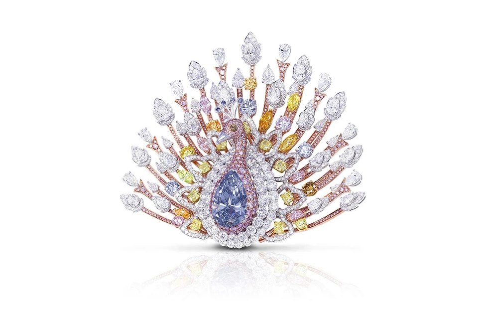 <p>Graff Diamonds unveils probably the most valuable brooch in the world at TEFAF, Maastricht – a $100 million diamond peacock brooch, featuring a 20.02ct blue diamond</p>