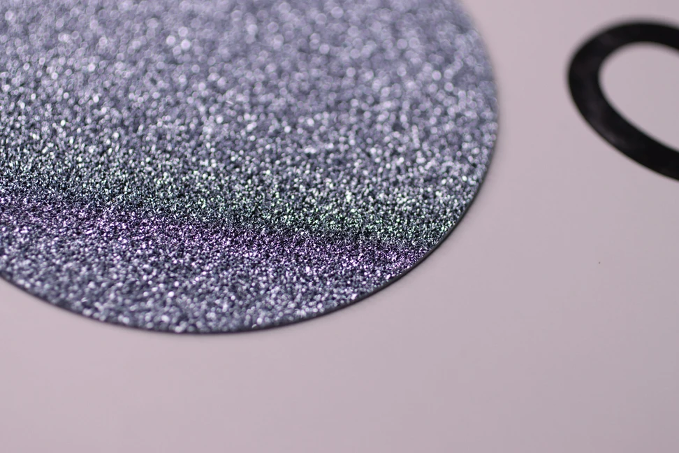 <p>A large, flat disc of crystalline osmium that can be cut into shapes and set into fine and high jewellery creations </p>
