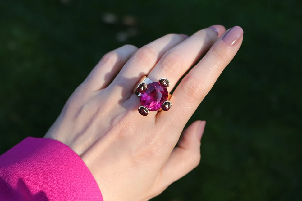 <p>Katerina tries on Jochen Leën’s Quadripod ring, which sets an intense 28.85-carat oval rubellite in four satisfyingly chunky claws of 18k white gold</p>