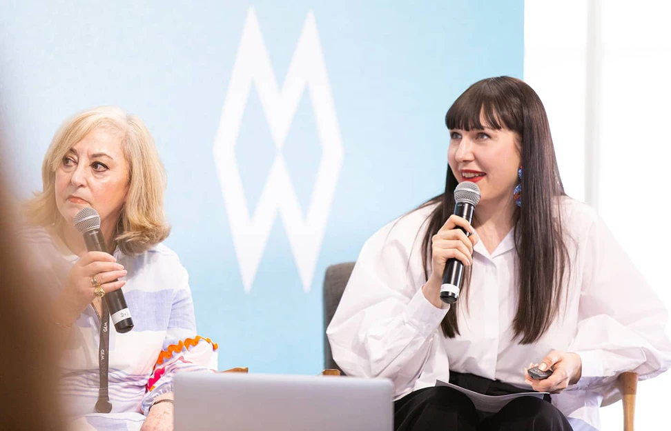 <p>Katerina Perez hosts a panel discussion at GemGenève in May 2022 with jewellery historian Vivienne Becker (left)</p>
