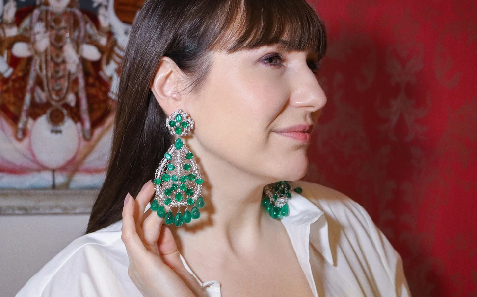 <p>Katerina Perez wearing Amrapali earrings in gold set with over 177-cts of emeralds and diamonds</p>