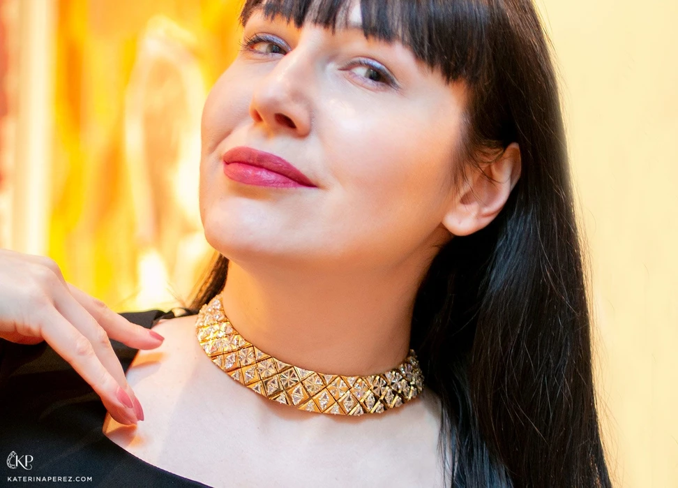 <p>Katerina Perez wears an 18k yellow gold necklace with triangular-shaped diamonds which is due to be auctioned by Bonhams Paris in November 2021</p>
