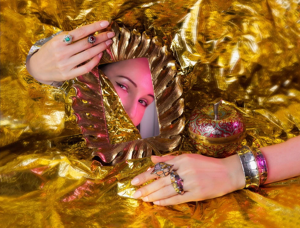 <p>Elie Top Medium Emerald Sphere ring and the Medium Ruby Sphere ring, both in gold and distressed silver with diamonds (top), Diamond Dorsal ring and the Diamond Dorsal Double ring (bottom hand) in yellow and rose gold and distressed silver with diamonds, and the Dorsal cuff in yellow gold and distressed silver with yellow gold wire detailing</p>
