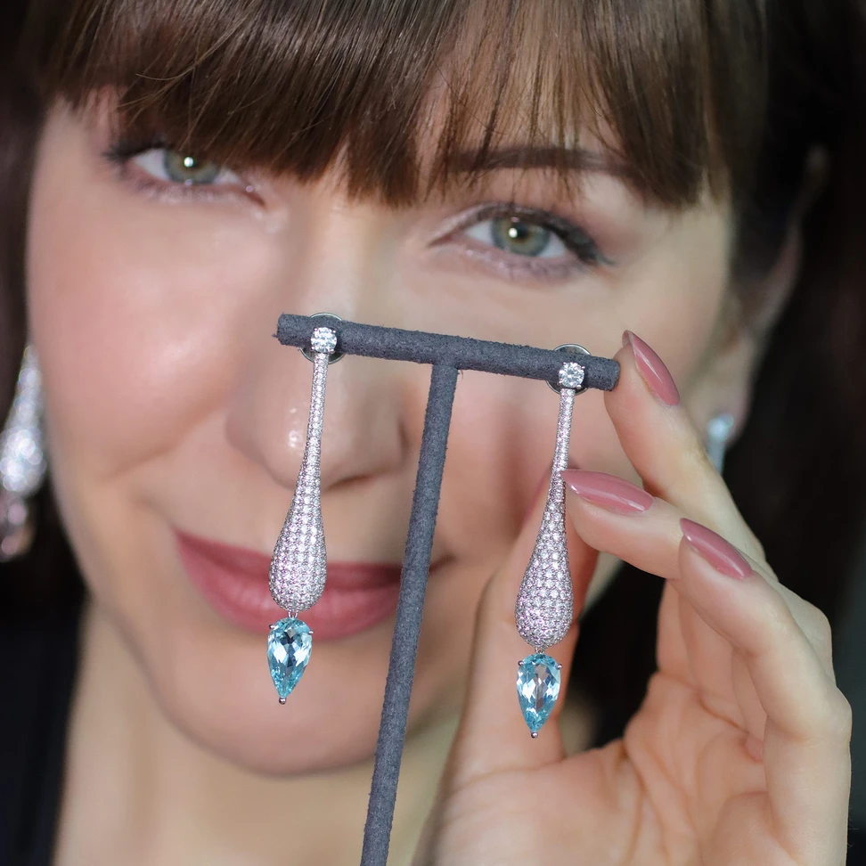 <p><span class="TextRun SCXP231295650 BCX0" lang="EN-US" xml:lang="EN-US" data-scheme-color="@000000,," data-usefontface="true" data-contrast="none"><span class="NormalTextRun SCXP231295650 BCX0">Drops of Grace earrings, handcrafted in </span></span><span class="TextRun MacChromeBold SCXP231295650 BCX0" lang="EN-US" xml:lang="EN-US" data-scheme-color="@000000,," data-usefontface="true" data-contrast="none"><span class="NormalTextRun SCXP231295650 BCX0">18k white gold with pavé set natural </span></span><span class="TextRun MacChromeBold SCXP231295650 BCX0" lang="EN-US" xml:lang="EN-US" data-scheme-color="@000000,," data-usefontface="true" data-contrast="none"><span class="NormalTextRun SCXP231295650 BCX0">diamonds </span></span><span class="TextRun SCXP231295650 BCX0" lang="EN-US" xml:lang="EN-US" data-scheme-color="@000000,," data-usefontface="true" data-contrast="none"><span class="NormalTextRun SCXP231295650 BCX0">totalling </span></span><span class="TextRun MacChromeBold SCXP231295650 BCX0" lang="EN-US" xml:lang="EN-US" data-scheme-color="@000000,," data-usefontface="true" data-contrast="none"><span class="NormalTextRun SCXP231295650 BCX0">8-9 carats and pear shape</span></span><span class="TextRun MacChromeBold SCXP231295650 BCX0" lang="EN-US" xml:lang="EN-US" data-scheme-color="@000000,," data-usefontface="true" data-contrast="none"><span class="NormalTextRun SCXP231295650 BCX0"> aquamarines </span></span><span class="TextRun SCXP231295650 BCX0" lang="EN-US" xml:lang="EN-US" data-scheme-color="@000000,," data-usefontface="true" data-contrast="none"><span class="NormalTextRun SCXP231295650 BCX0">of around </span></span><span class="TextRun MacChromeBold SCXP231295650 BCX0" lang="EN-US" xml:lang="EN-US" data-scheme-color="@000000,," data-usefontface="true" data-contrast="none"><span class="NormalTextRun SCXP231295650 BCX0">5-6 carats</span></span><span class="TextRun SCXP231295650 BCX0" lang="EN-US" xml:lang="EN-US" data-scheme-color="@000000,," data-usefontface="true" data-contrast="none"><span class="NormalTextRun SCXP231295650 BCX0"></span></span></p>