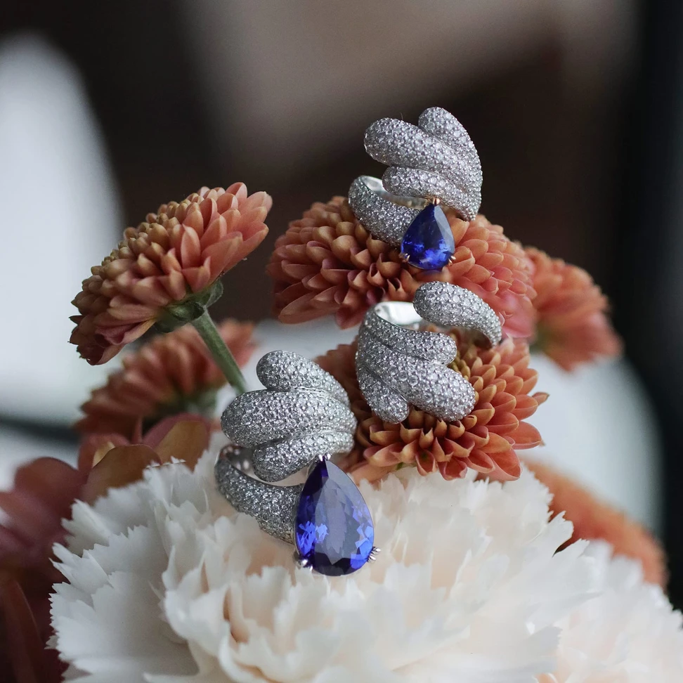 <p>Lumen of Grace earrings and ring <span class="TextRun BCX0 SCXP254411066" lang="EN-US" xml:lang="EN-US" data-scheme-color="@000000,," data-usefontface="true" data-contrast="none"><span class="NormalTextRun BCX0 SCXP254411066"><span class="TextRun SCXP263013176 BCX0" lang="EN-US" xml:lang="EN-US" data-scheme-color="@000000,," data-usefontface="true" data-contrast="none"><span class="NormalTextRun SCXP263013176 BCX0">from <span class="TextRun BCX0 SCXP163336872" lang="EN-US" xml:lang="EN-US" data-scheme-color="@000000,," data-usefontface="true" data-contrast="none"><span class="NormalTextRun BCX0 SCXP163336872">Youngsun Nam’s</span></span> Inner Garden </span></span><span class="TextRun SCXP263013176 BCX0" lang="EN-US" xml:lang="EN-US" data-scheme-color="@000000,," data-usefontface="true" data-contrast="none"><span class="NormalTextRun SCXP263013176 BCX0">Collection</span></span><span class="TextRun SCXP263013176 BCX0" lang="EN-US" xml:lang="EN-US" data-scheme-color="@000000,," data-usefontface="true" data-contrast="none"><span class="NormalTextRun SCXP263013176 BCX0"> with diamonds in 18k white gold. The earrings feature 3 carats of pear shape tanzanites</span></span></span></span></p>