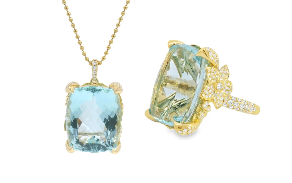 <p>A Brazilian aquamarine ring and matching pendant necklace by Lisa Nik, crafted with diamonds in 18k yellow gold </p>

