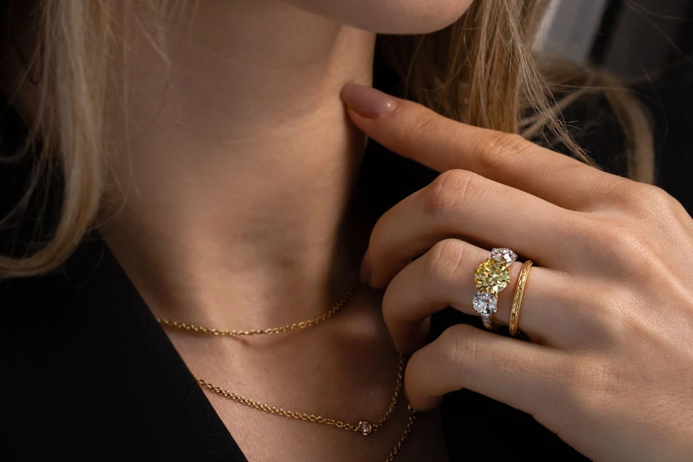 <p>Model wearing a Hancocks antique 2.41ct Fancy Intense yellow diamond ring with Old European-cut diamond shoulders</p>

