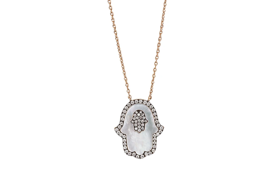 <p>Molu Hamsa hand in mother-of-pearl and diamonds</p>
