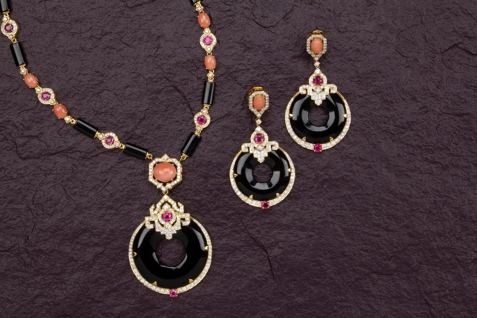 <p>Nafees Jaipur matching pendant necklace and earrings set drawing inspiration from the Art Deco period with carved black onyx </p>
