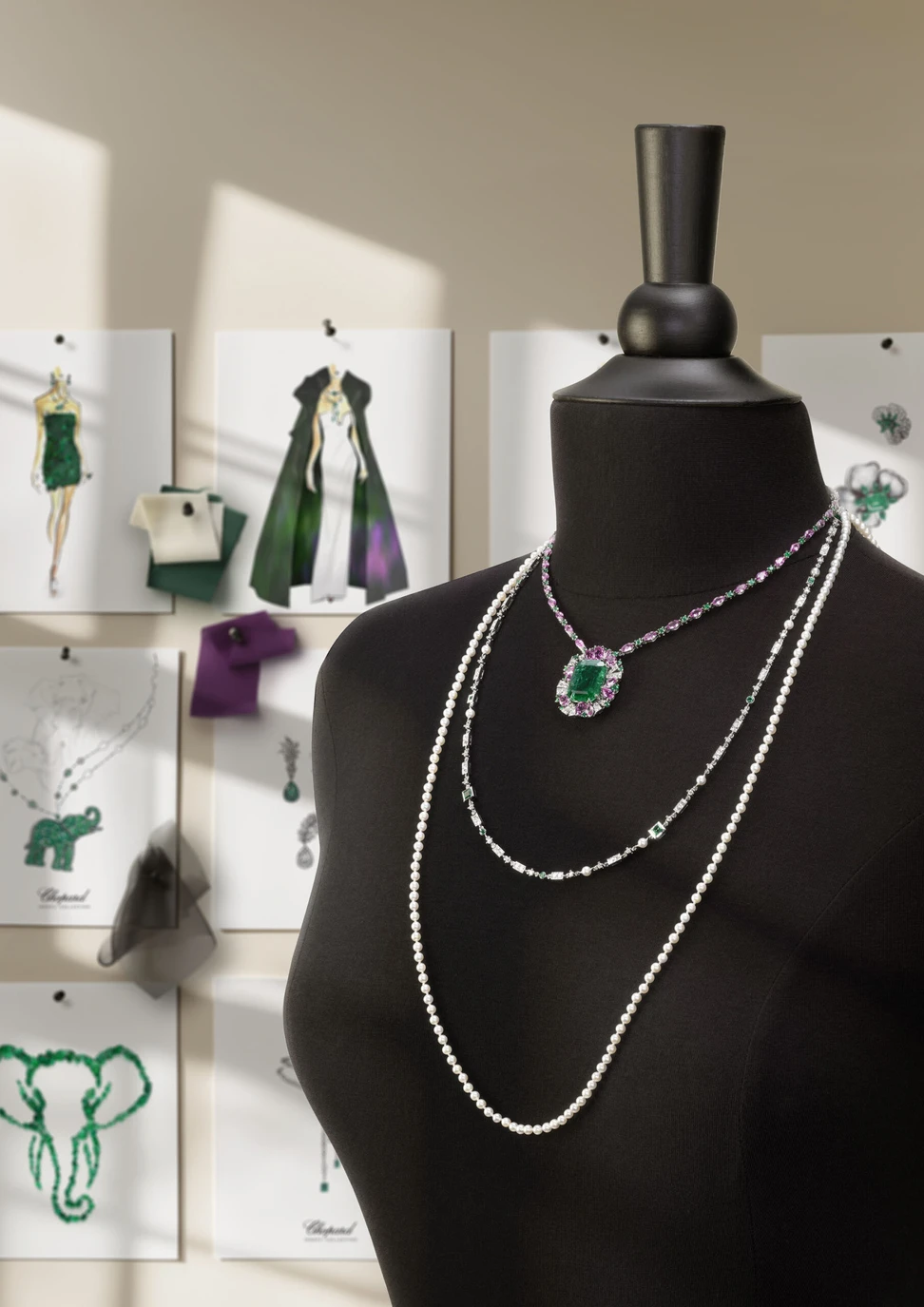 <p>Three layered necklaces from Chopard’s Insofu collection, featuring emeralds, diamonds, pink sapphires, and pearls</p>