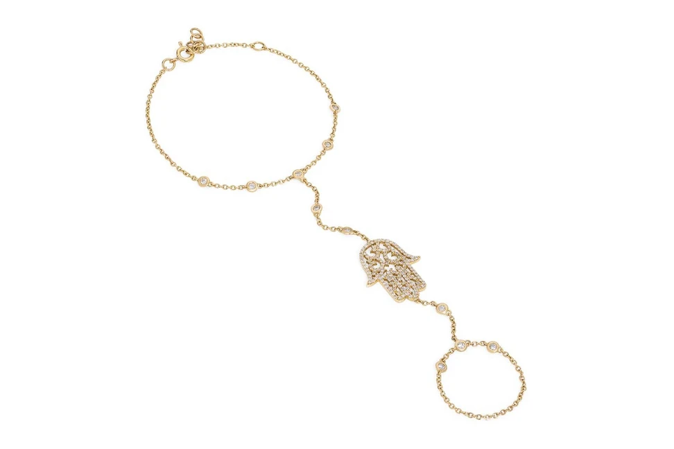 <p>Noudar Slave bracelet in yellow gold and diamonds</p>