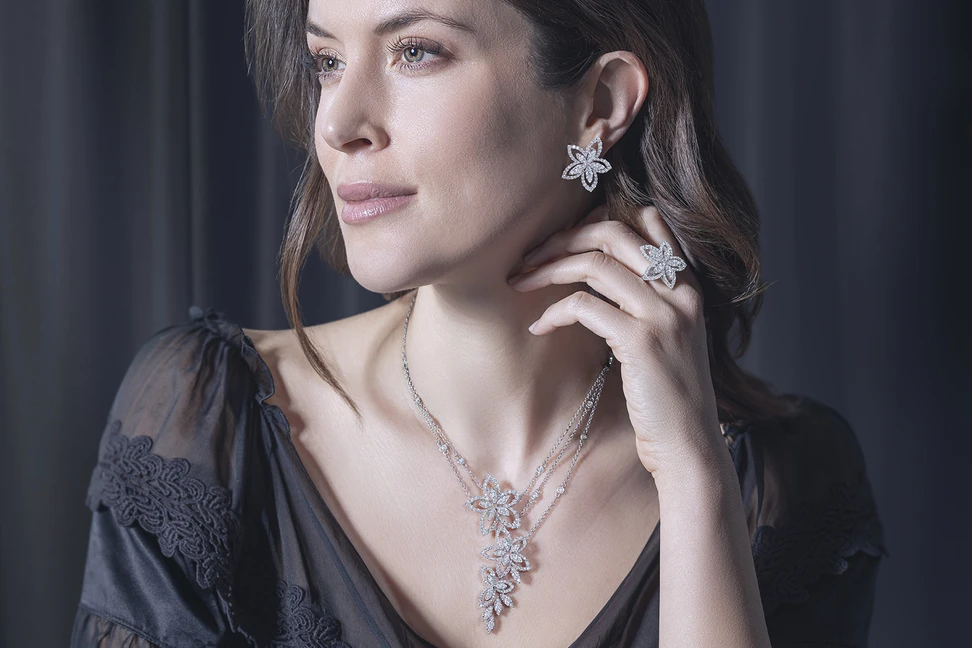 <p>A model wears the Picchiotti Flowers suite from the Picchiotti Classics collection with round brilliant-cut diamonds set in 18k white gold </p>