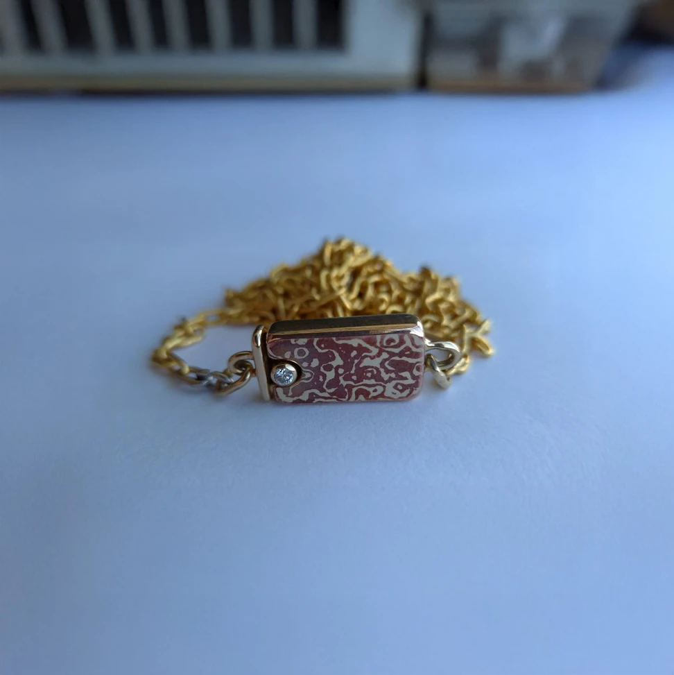 <p>Among the missing treasures was a yellow gold mokume-gane necklace</p>
