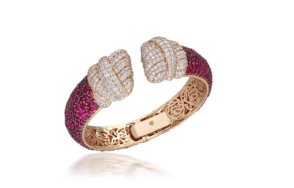 <p>A diamond and ruby bracelet set in 18k yellow gold by Renu Oberoi</p>