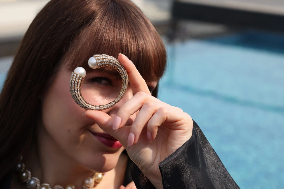 <p>Katerina Perez spotlights the Golden Sphere cuff bracelet by Renu Oberoi, set with 15 carats of diamonds and 46 carats of iridescent pearls</p>