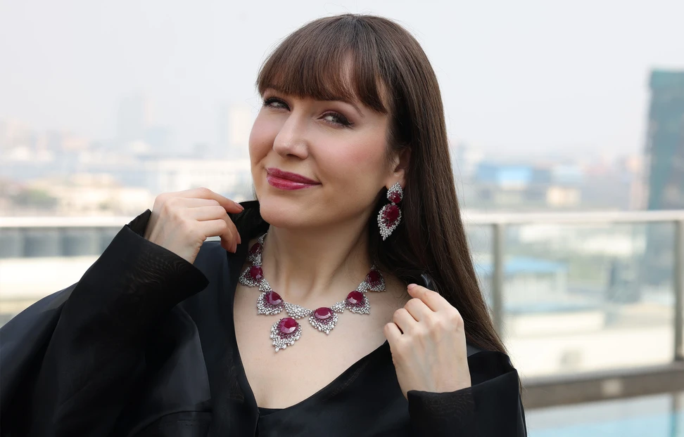 <p>Katerina Perez wears the Crimson Cascade necklace by Renu Oberoi with 87.7 carats of Mozambique rubies and 22.94 carats of round and pear-shaped diamonds</p>