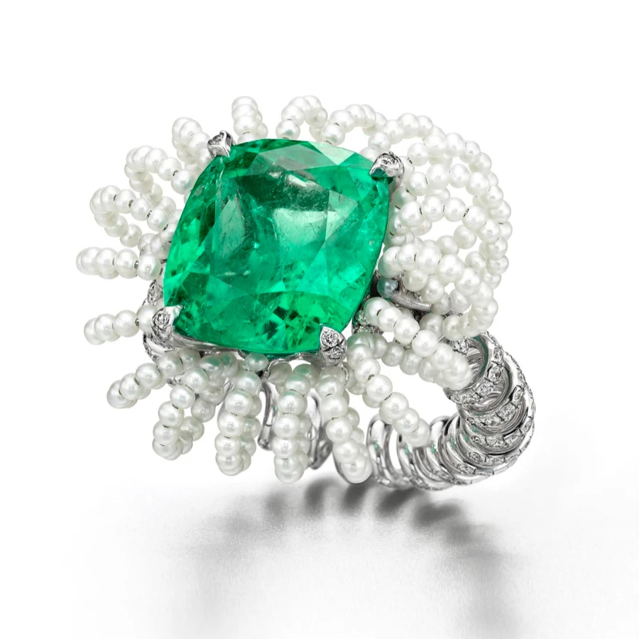 <p>Suzanne Syz Picture Perfect ring in white gold and titanium set with: Colombian Emerald 10.37 cts, 175 Diamonds 1.08 ct, Seed Pearls 8.10 cts</p>
