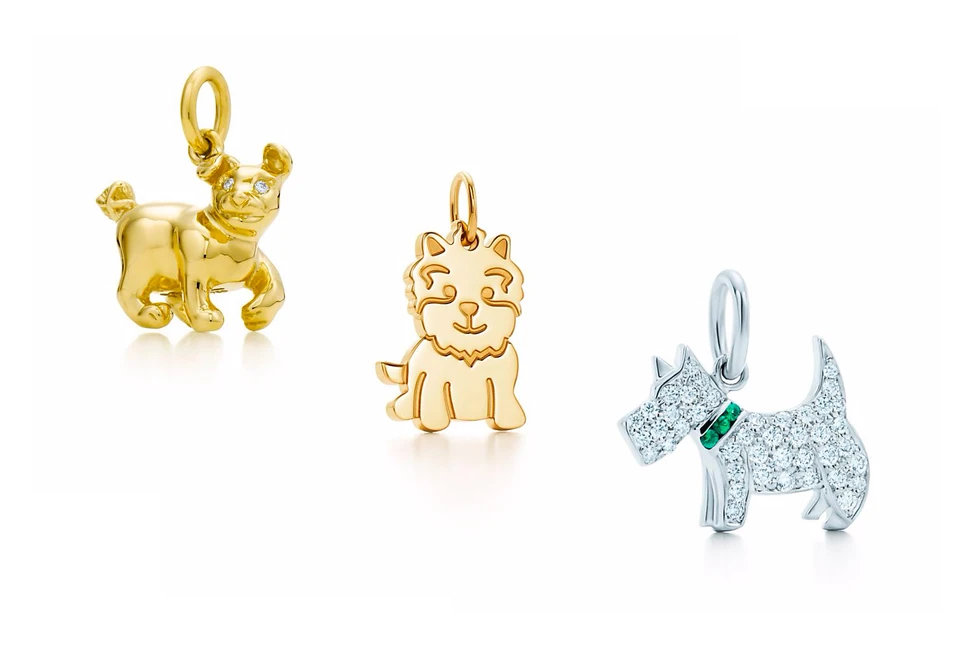 <p>Tiffany&Co. Paloma’s Chinese Zodiac Dog Charm, New Yorkie charm in gold, Tsavorite Dog charm in white gold with diamonds</p>