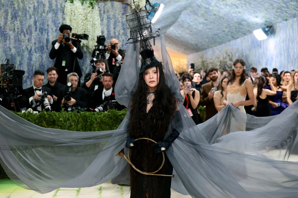 <p>Madonna’s eccentric Saint Laurent look recreated a 1945 painting by the Mexican Surrealist artist Leonora Carrington, with a Falcon Crest pendant and chain by Castro NYC providing a final, talismanic detail</p>