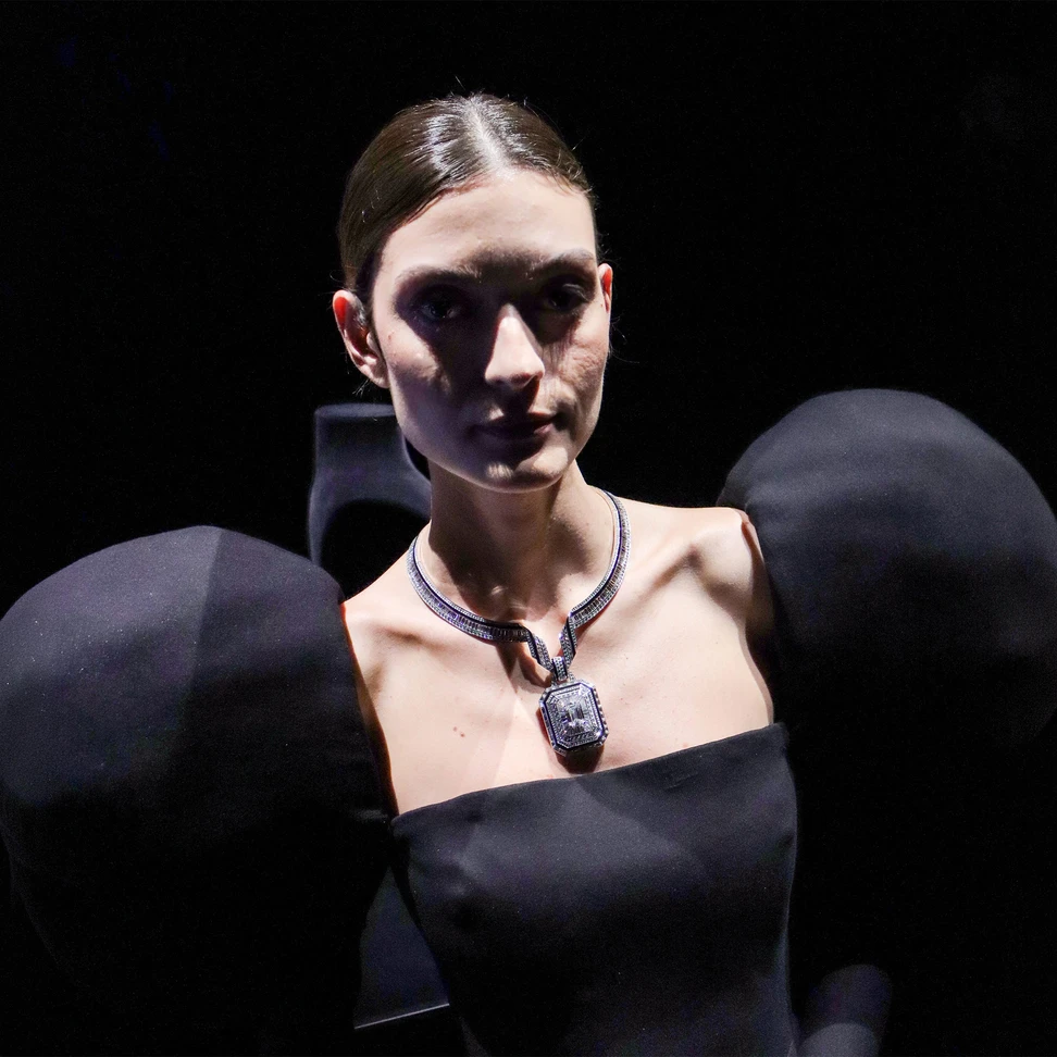 <p>A model wears The Address necklace from the Histoire de Style ‘Nom: Boucheron Prénom: Frédéric’ High Jewellery collection, accompanied by a dress with puffy leg-of-mutton sleeves</p>