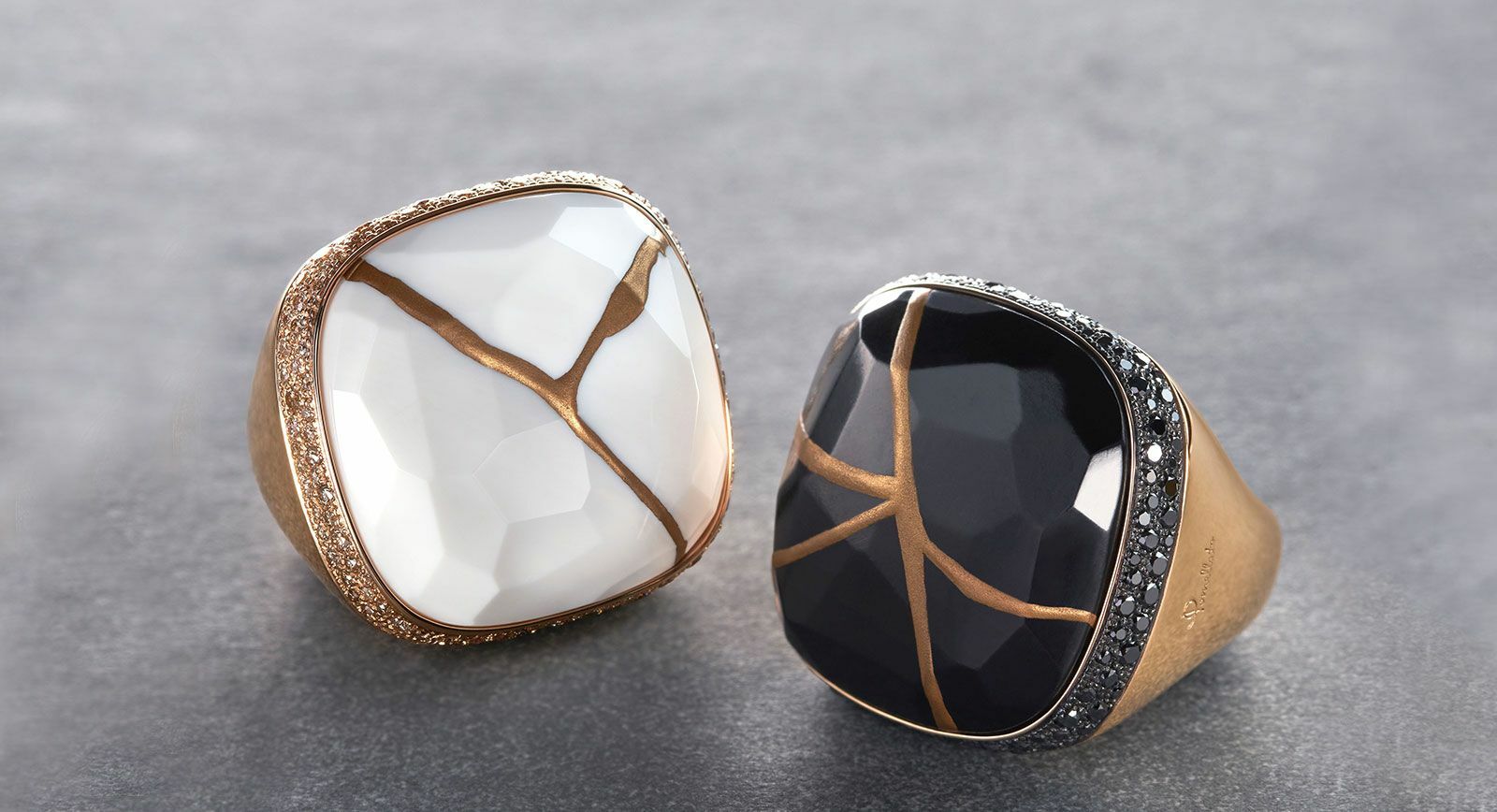 Pomellato Kintsugi collection cocktail rings with jet and kogolong (cacholong) in gold